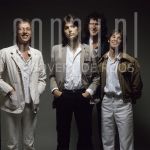 02-09-1978 Dire Straits at studio in Amsterdam.

[keywords]Posed, Full Length, Eyecontact, Smiling, Singer, Musicians[/keywords]